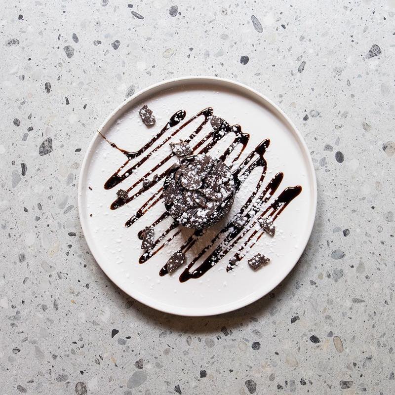 Chocolate Soufflé: chocolate syrup, chocolate chips and powdered sugar