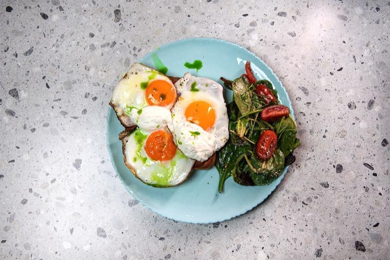 Eggcelent: 3 sunny-side up eggs on top of a slice of sourdough bread, Florina pepper sauce, feta mousse and aromatic chive…