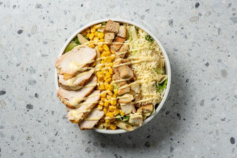 Pasta Gallus: Penne pasta, lettuce, iceberg, chicken fillet, corn, homemade croutons, kefalotiri cheese and mustard sauce