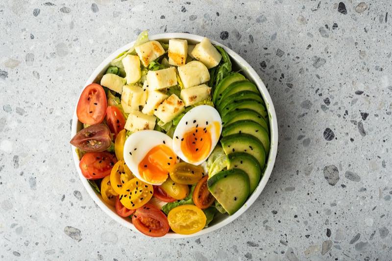 Rainbow: Lettuce, iceberg, avocado, boiled egg, colorful cherry tomatoes, grilled halloumi cheese, black sesame and balsamic…