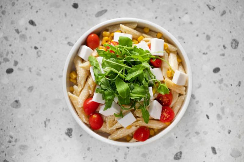 Ronald Vegan: Whole wheat penne pasta, vegan mayo with chives, vegan cheese, corn, cherry tomatoes and rocket